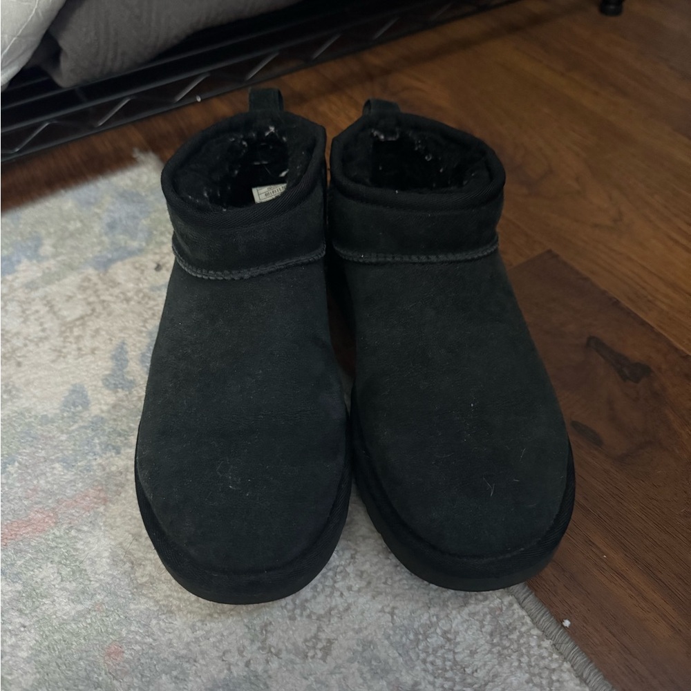 Women’s black mini Uggs